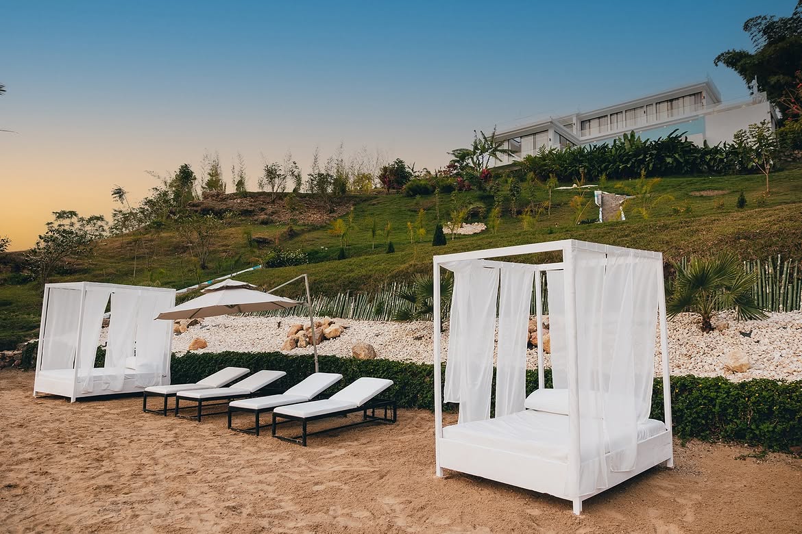 Private beach day beds at Ever Retreat on Lake Kivu at sunset
